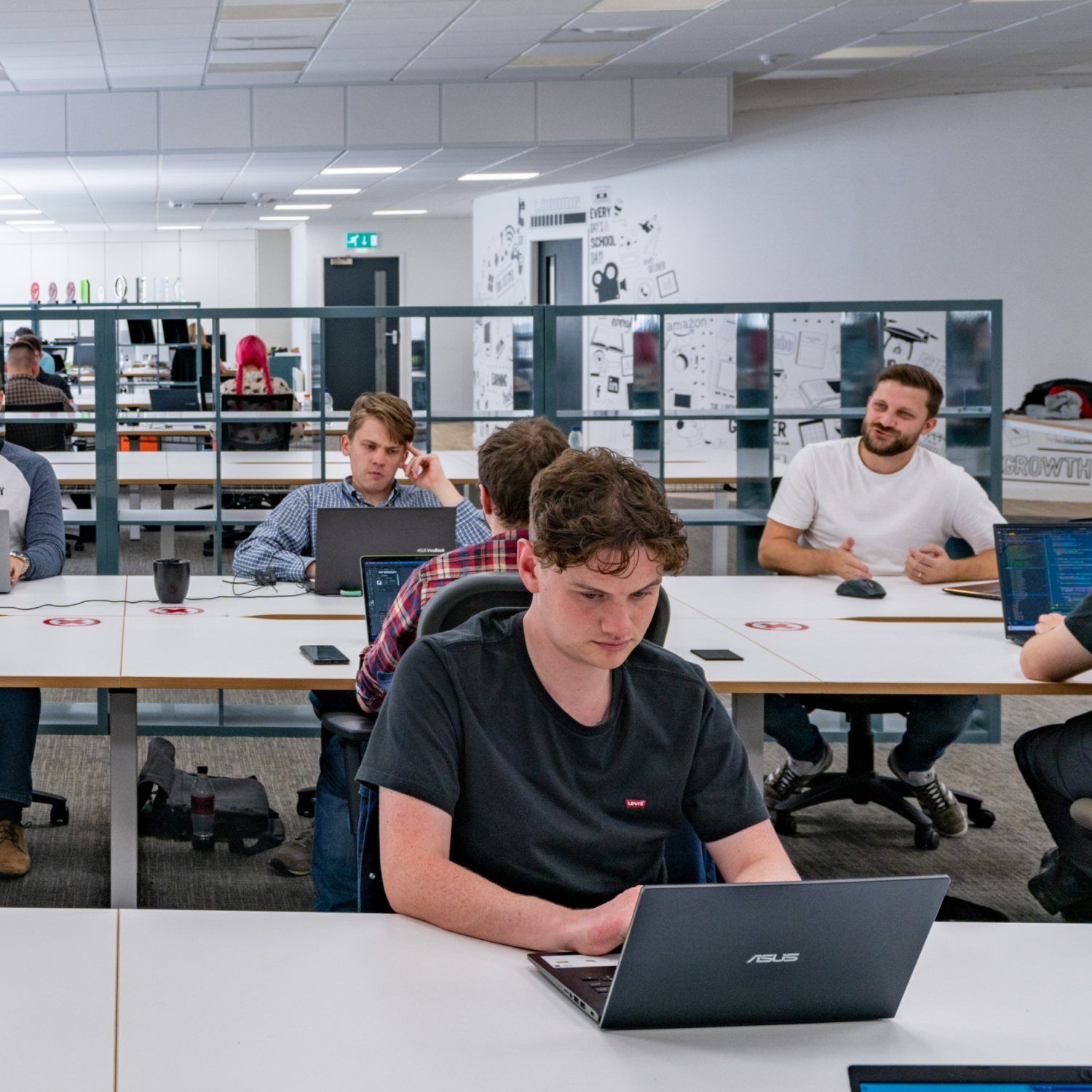 Image of Austin Waddecar and team in Office