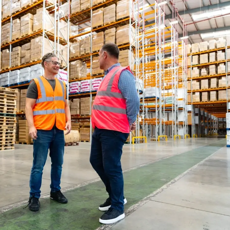 Image of a conversation with our warehouse partner at Irlam Warehouse